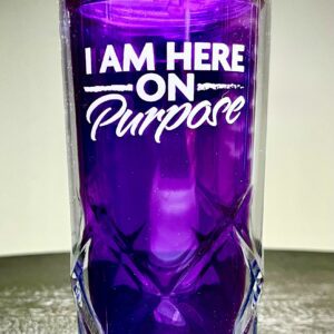 A purple glass with the words " i am here on purpose ".